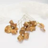Set de 5 epingles à chignon mariage ornés de fleurs dorées et d'une perle.